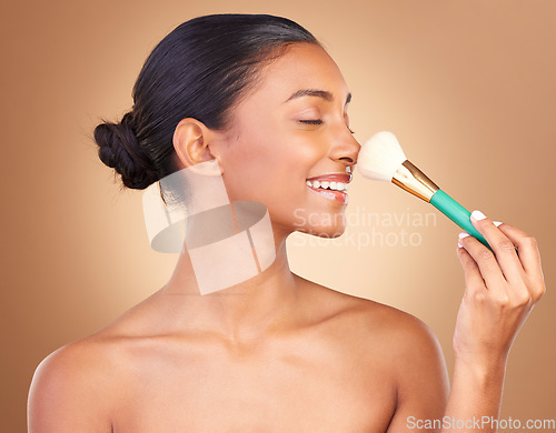 Image of Makeup brush, smile and happy woman with natural beauty, wellness and shine from cosmetics. Facial skin glow, relax and cosmetic artist tool of a young female model with self care in a studio