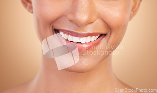 Image of Woman, smile with teeth and dental with beauty and healthcare, face and mouth closeup on studio background. Skin, glow and whitening with cosmetic care, health and veneers, female and oral hygiene