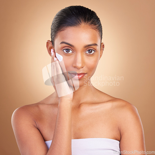 Image of Skincare, beauty cream and portrait of a healthy woman with cosmetic and spa lotion. Isolated, studio background and young model with sunscreen for face cleaning, cosmetics and dermatology facial