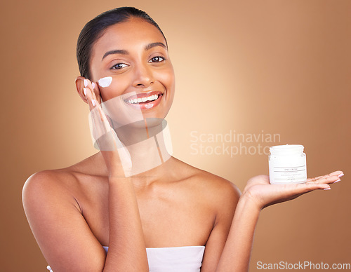 Image of Skincare beauty, sunscreen product and portrait of a happy woman with cosmetic and spa cream. Isolated, studio background and young model with a smile from face cleaning, cosmetics and dermatology