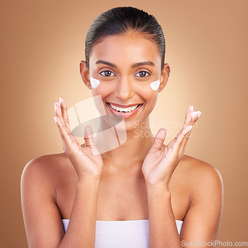 Image of Skincare, sunscreen and portrait of a happy woman with cosmetic and spa cream. Isolated, studio background and young model with a smile from beauty cleaning, cosmetics and dermatology facial product