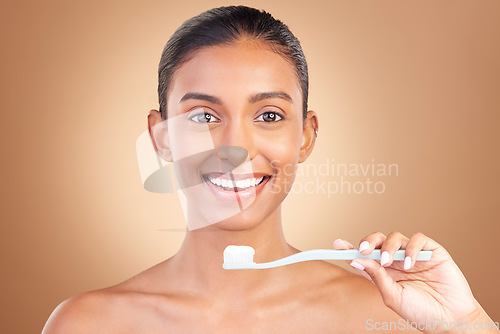 Image of Woman, smile in portrait with teeth and toothbrush, cleaning with oral hygiene product isolated on studio background. Happy female, orthodontics and dental with mockup space, health and toothpaste