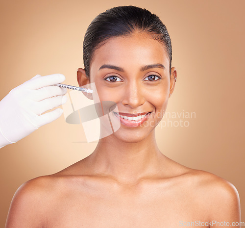 Image of Woman, face injection and needle, dermatology and skincare, plastic surgery on studio background. Female in portrait, beauty and smile, cosmetics procedure with facelift treatment and cosmetic care