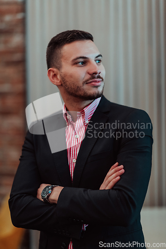 Image of Portrait of a young businessman in a modern suit. Portrait of the company director in his office. Selective focus