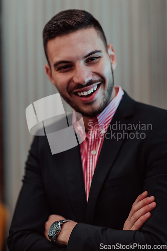 Image of Portrait of a young businessman in a modern suit. Portrait of the company director in his office. Selective focus