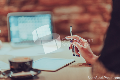 Image of Business strategy analysis. Businessman, accountant holding pen working on laptop computer, accounting financial business report and accountancy document with calculator on desk at office, close up