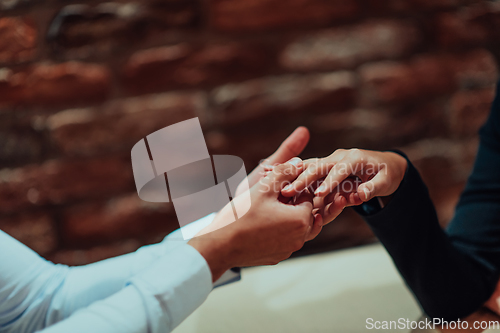 Image of Photo of business shaking hands, finishing up meeting. Successful businesspeople handshaking after good deal