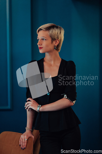 Image of Blonde business woman, successful confidence on modern blue mat background. Selective focus