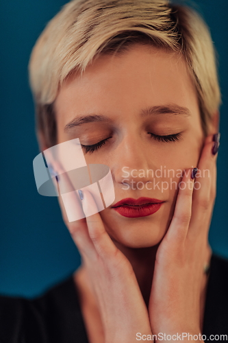 Image of Photo Beautiful businesswoman, successful confident young woman posing with hands on face. Selective focus