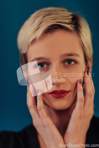 Image of Photo Beautiful businesswoman, successful confident young woman posing with hands on face. Selective focus