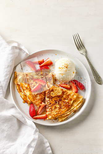 Image of reshly baked crepes with ice cream