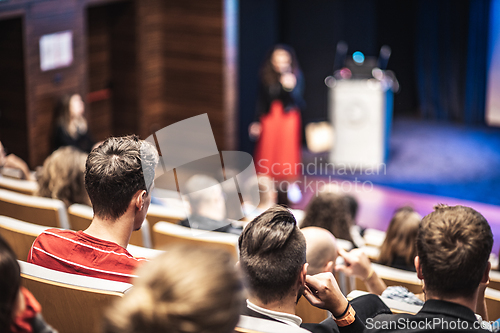 Image of Woman giving presentation on business conference event.