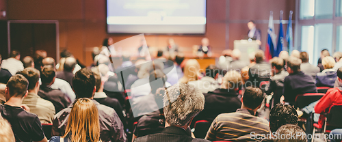 Image of Business speaker giving a talk at business conference event.