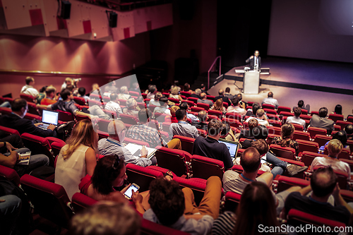 Image of Business speaker giving a talk at business conference event.