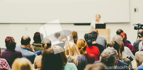 Image of Woman giving presentation on business conference.