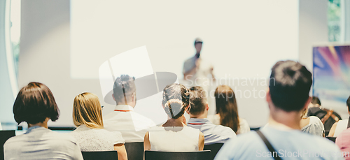 Image of Business speaker giving a talk at business conference event.