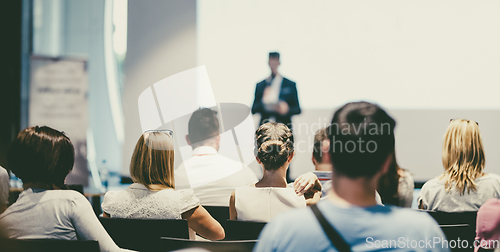 Image of Male business speaker giving a talk at business conference event.