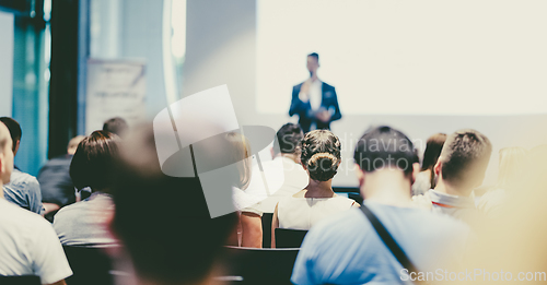 Image of Male business speaker giving a talk at business conference event.