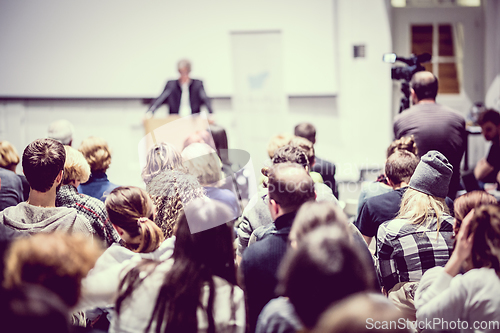 Image of Business speaker giving a talk at business conference event.