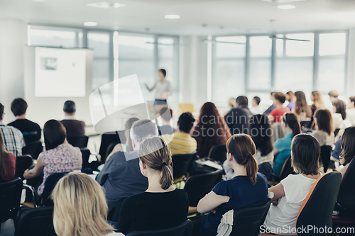 Image of Speaker giving presentation on business conference.