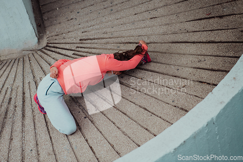 Image of Fit attractive woman in sportswear stretching before jogging. Workout, sport, activity, fitness, vacation and training concept.