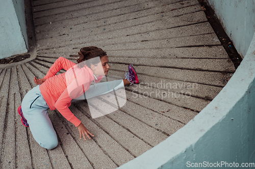 Image of Fit attractive woman in sportswear stretching before jogging. Workout, sport, activity, fitness, vacation and training concept.