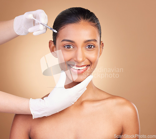 Image of Woman, face injection and needle in portrait, beauty and dermatology, skincare with plastic surgery on studio background. Female, hands and smile, cosmetic procedure with facelift treatment and skin