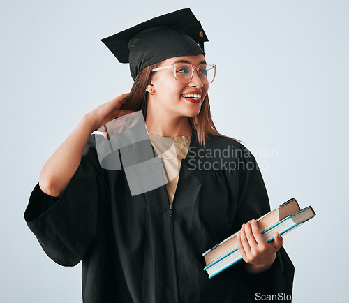 Image of Graduation cap, books and woman isolated on studio background for happy education, college or scholarship success. Biracial university student or graduate with reading knowledge and learning goals