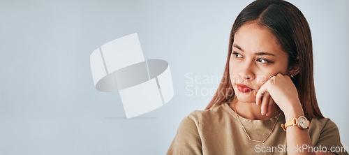 Image of Woman, thinking and space for idea in studio with . advertising or product placement mockup. Face of female on white background serious, doubt or planning and contemplating logo or branding decision