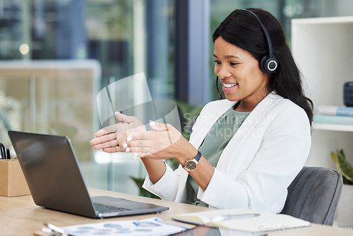 Image of Video call center of black woman, agent or consultant in office online meeting, virtual communication or telecom on laptop. Business worker or happy person consulting, speaking or advice on computer