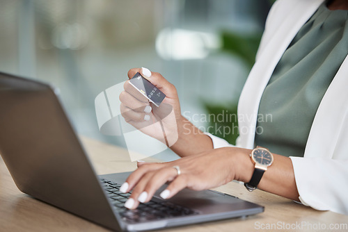 Image of Woman hands, credit card and laptop for business online shopping, banking or fintech payment at her office. Professional person typing financial code information on computer for loan or transaction