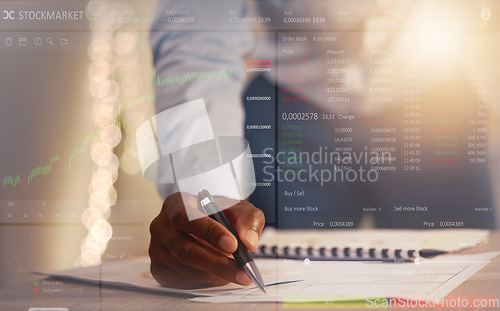 Image of Businessman, hands and writing at night on stock market analysis, finance or cryptocurrency on office desk. Hand of man in financial trading analytics or investing working late with dashboard overlay