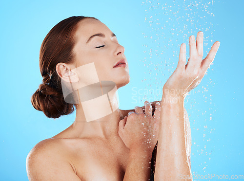 Image of Shower, beauty and woman with water in studio for wellness, body hygiene and cleaning satisfaction. Skincare, girl and model on bathroom mockupwith hands for dermatology, luxury and washing products