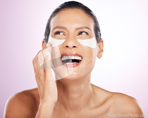 Image of Laughing, skincare and woman eye patches in studio isolated on purple background. Thinking, dermatology cosmetics or funny, face and mature female model with facial mask for anti aging or collagen.