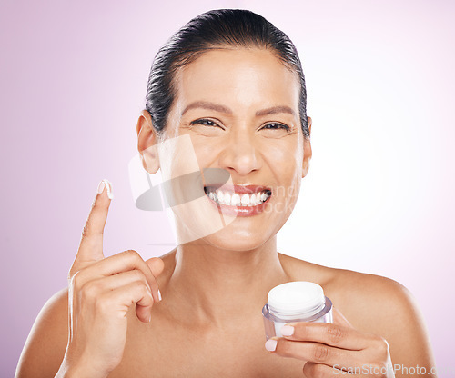 Image of Face, cream jar and skincare of woman in studio isolated on purple background. Mature portrait, cosmetics and happy female model with dermatology lotion, creme or moisturizer product for healthy skin