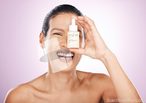 Image of Laughing, face and woman with serum bottle in studio isolated on purple background. Skincare, cosmetics portrait and happy, funny or mature female model with hyaluronic acid, retinol or essential oil