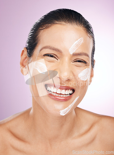 Image of Face, laughing and woman with skincare cream in studio isolated on purple background. Dermatology, cosmetics portrait and happy mature female with lotion, creme or moisturizer product for skin health