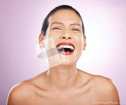 Image of Laughing, face makeup and lipstick of woman in studio isolated on a purple background. Skincare, cosmetics portrait and happy, funny and mature female model with red lip gloss for skin glow or beauty