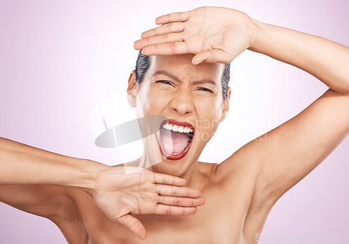 Image of Portrait, beauty and a screaming woman in studio on a pink background for skincare or expression. Face, hands and emotion with an attractive young female shouting for natural treatment or cosmetics