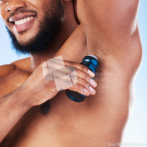 Image of Deodorant, armpit and black man with products for beauty, grooming and body hygiene on blue background. Skincare, wellness and male with antiperspirant, fragrance and scent product for fresh underarm