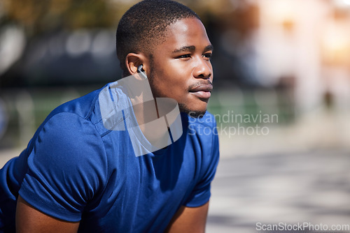 Image of Fitness, break and man runner relax with music before training, running or morning cardio outdoors. Sports, pause and male athlete breathing, mindset and preparation for marathon practice workout run