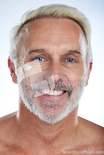 Image of Old man, cream and portrait, face with skincare and beauty, hygiene with grooming on studio background. Lotion, moisturizer and dermatology, anti aging cosmetic care and senior male and smile