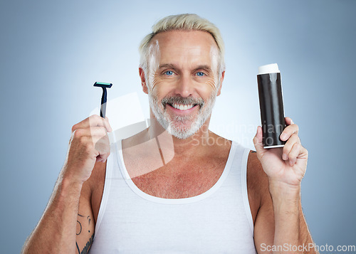 Image of Senior man, razor and shaving cream for grooming, skincare or hair removal against studio background. Portrait of mature male holding shaver and foam creme for haircare, cosmetics or facial treatment