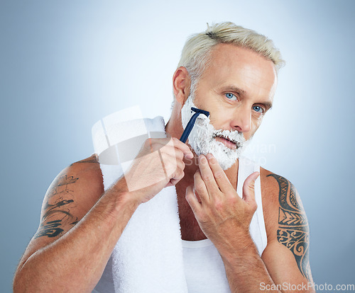 Image of Senior man, razor and shaving cream for skincare grooming, beard or hair removal against a studio background. Portrait of mature male with shaver, creme or foam for clean facial treatment on mockup