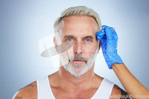 Image of Syringe, facial and portrait of a senior man in a studio doing plastic surgery and cosmetic skincare. Dermatology, wrinkles and anti aging treatment of a mature model with silicone filler injection