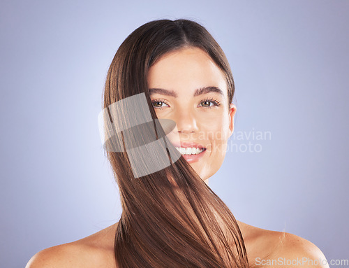 Image of Woman smile, beauty portrait and hair care in studio for texture, growth and shine on blue background. Aesthetic female model face for self love, haircare and cosmetics for salon or hairdresser