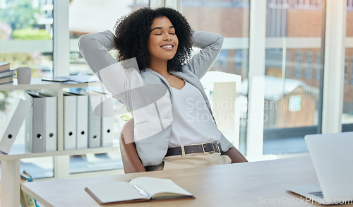 Image of Happy business woman stretching at desk for relax, career success and work life balance in her office. Professional worker or biracial person calm, confident and peace for project time management
