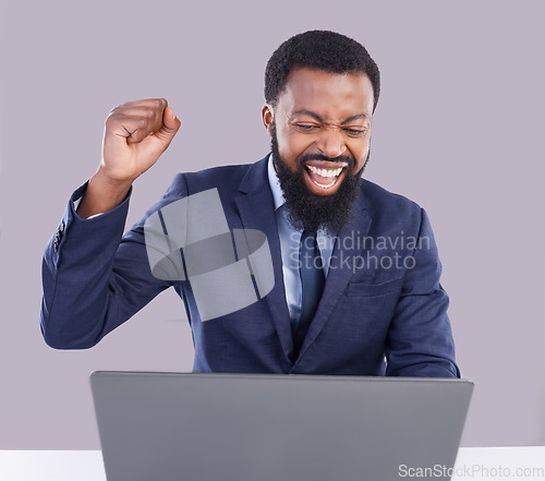 Image of Winning, laptop and black man isolated on gray background for stock market, trading or business bonus with fist pump. Yes, success and winner person on computer sales, profit or celebration in studio