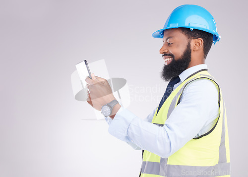 Image of Tablet, construction and building with an engineer black man in studio on gray background for architecture. Internet, research and project management with a male handyman or contractor in engineering