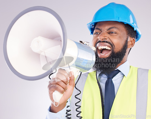 Image of Engineer black man, megaphone and construction in studio portrait for angry shouting by white background. Engineering, architect or manager with loudspeaker in workplace with anger on frustrated face